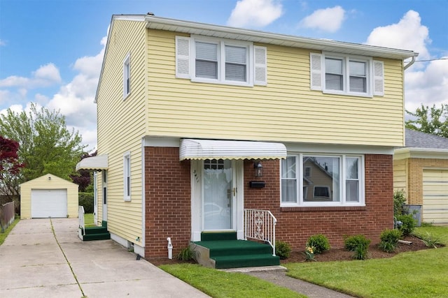 3411 Elmwood St, Erie, PA 16508 - colonial home with brick siding, an outbuilding, driveway, and a garage