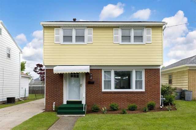 3411 Elmwood St, Erie, PA 16508 - colonial inspired home with brick siding, a front lawn, central AC, and driveway