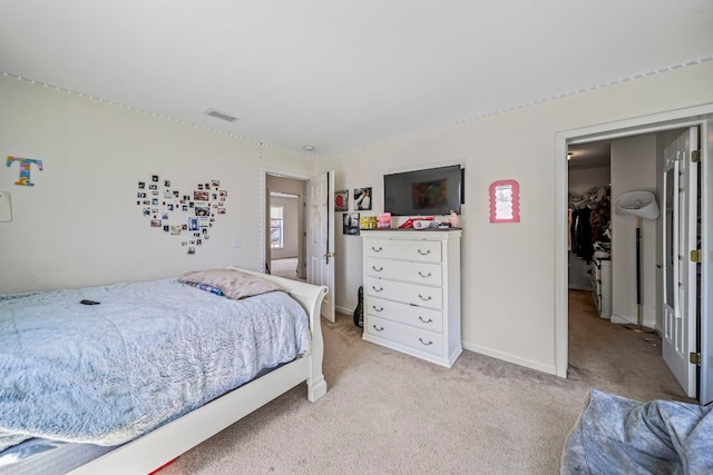 2521 Mccain Ave, Erie, PA 16510 - bedroom featuring a spacious closet, light carpet, visible vents, and baseboards