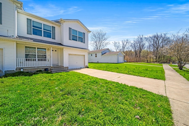 2521 Mccain Ave, Erie, PA 16510 - view of front of house featuring concrete driveway, an attached garage, a front lawn, and covered porch