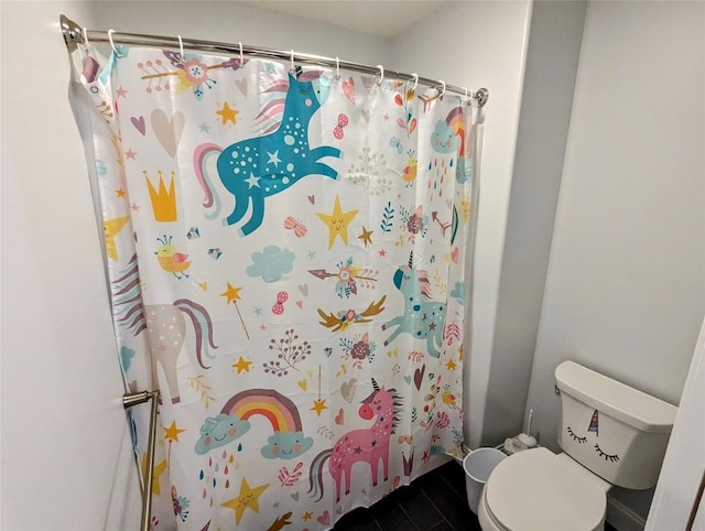 bathroom with toilet and walk in shower