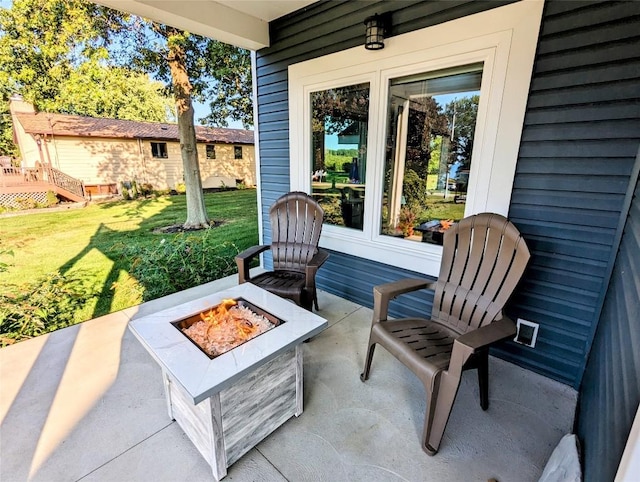 view of patio with a fire pit