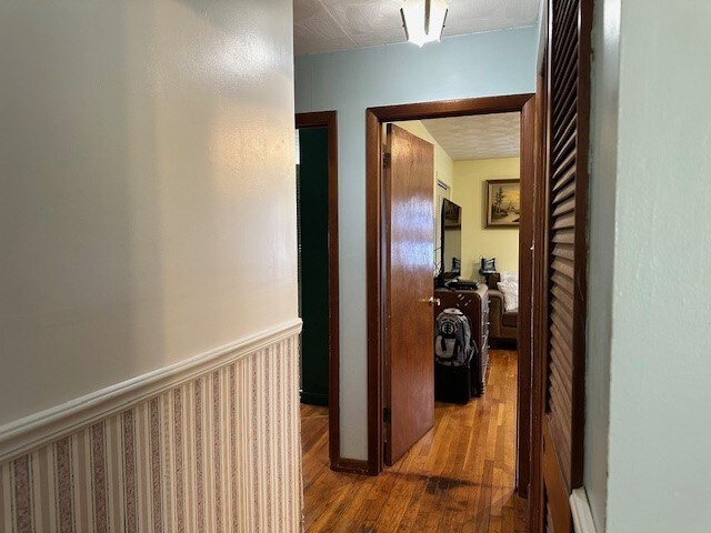 hallway with wood finished floors