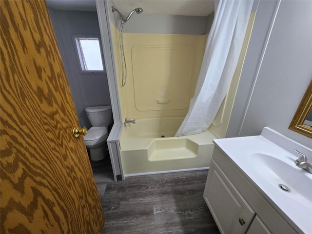 full bathroom with toilet, wood-type flooring, vanity, and shower / tub combo with curtain