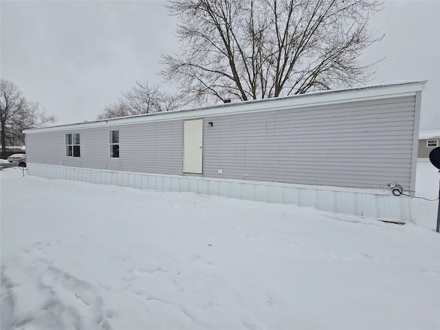 view of snow covered house