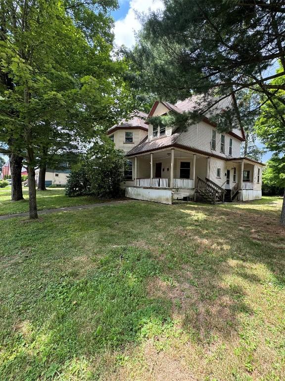 view of yard featuring a porch