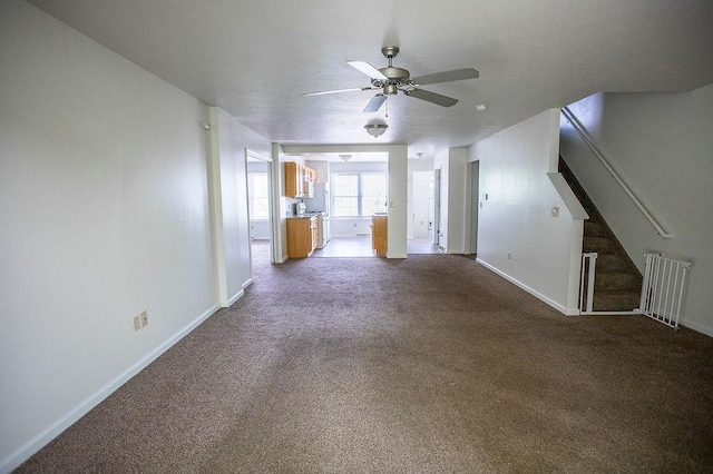4165 Wood Hills Dr Unit C9, Erie, PA 16510 - unfurnished living room featuring baseboards, ceiling fan, dark carpet, and stairs