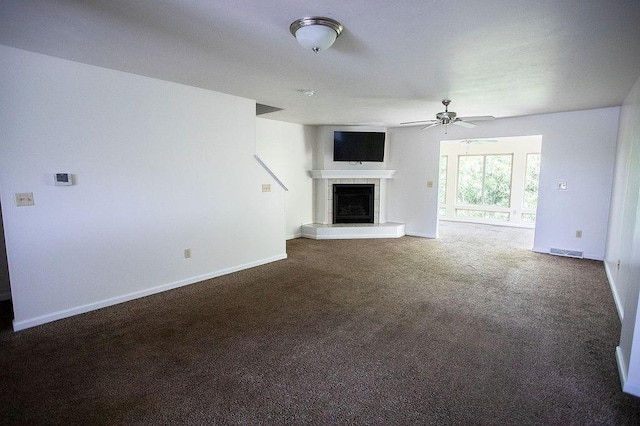4165 Wood Hills Dr Unit C9, Erie, PA 16510 - unfurnished living room with a tiled fireplace, carpet, ceiling fan, and baseboards
