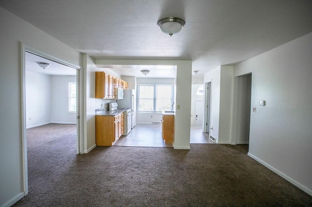 4165 Wood Hills Dr Unit C9, Erie, PA 16510 - kitchen with gas range gas stove, dark colored carpet, brown cabinetry, and light countertops
