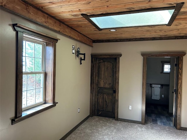 11667 Lakeland Dr, Conneaut Lake, PA 16316 - spare room with a skylight, light colored carpet, a wealth of natural light, and wood ceiling