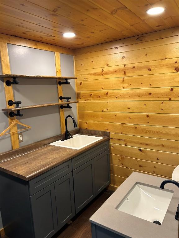 11667 Lakeland Dr, Conneaut Lake, PA 16316 - laundry room with wooden walls, wooden ceiling, and a sink