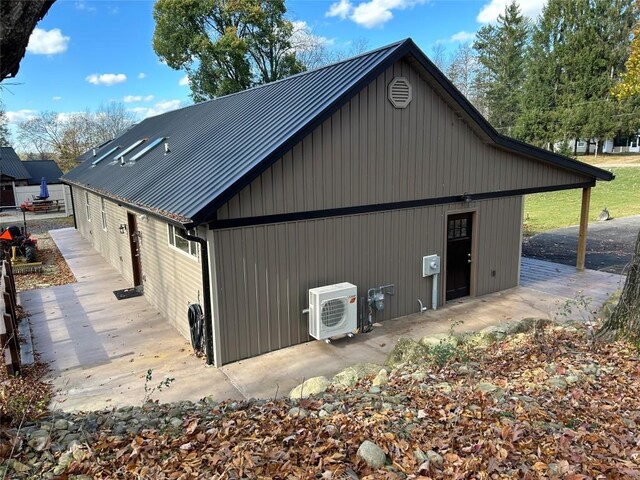 11667 Lakeland Dr, Conneaut Lake, PA 16316 - view of side of home featuring ac unit and metal roof