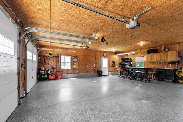 18376 Barber Rd, Meadville, PA 16335 - garage with a garage door opener and a workshop area