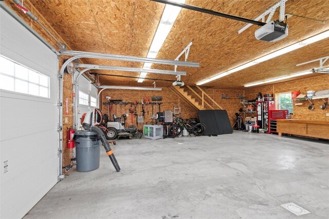 18376 Barber Rd, Meadville, PA 16335 - garage with a garage door opener and a workshop area
