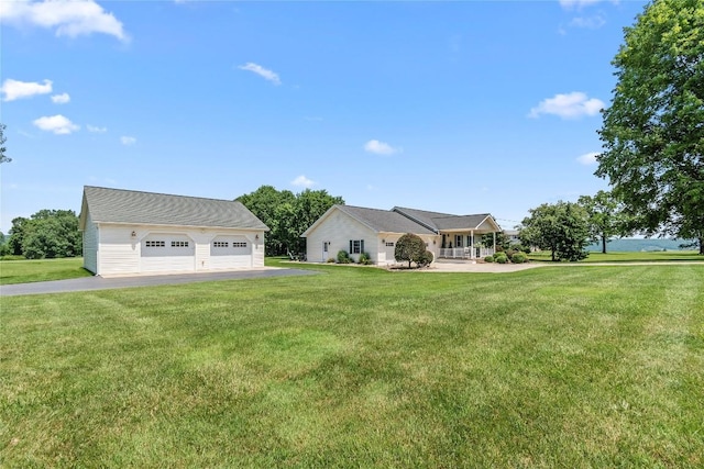 18376 Barber Rd, Meadville, PA 16335 - view of front of home with a detached garage, an outbuilding, and a front lawn