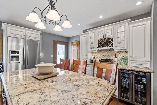 18376 Barber Rd, Meadville, PA 16335 - kitchen with wine cooler, stainless steel refrigerator with ice dispenser, white cabinets, tasteful backsplash, and glass insert cabinets