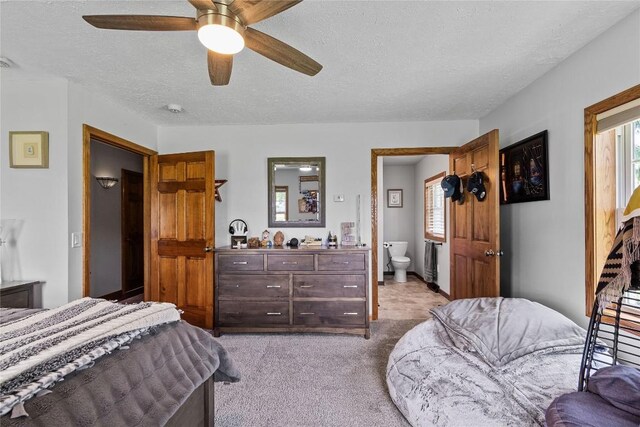 18376 Barber Rd, Meadville, PA 16335 - bedroom with a textured ceiling, multiple windows, light carpet, ensuite bath, and a ceiling fan