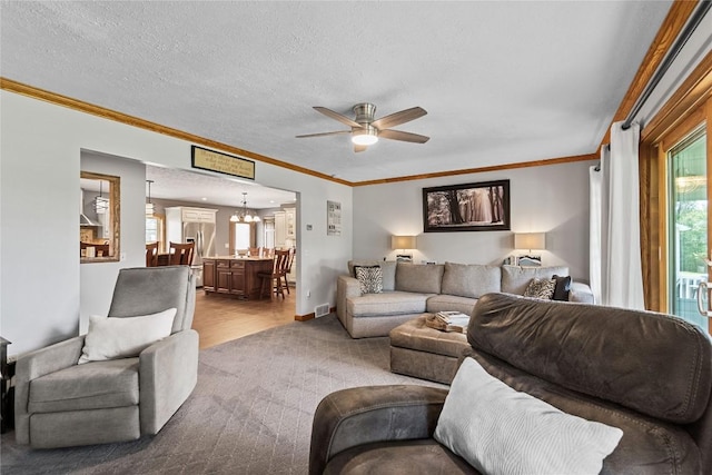 18376 Barber Rd, Meadville, PA 16335 - living room featuring ceiling fan, ornamental molding, a chandelier, wood finished floors, and a textured ceiling