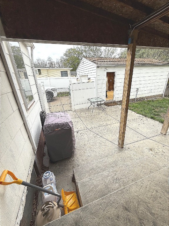 view of patio / terrace featuring fence