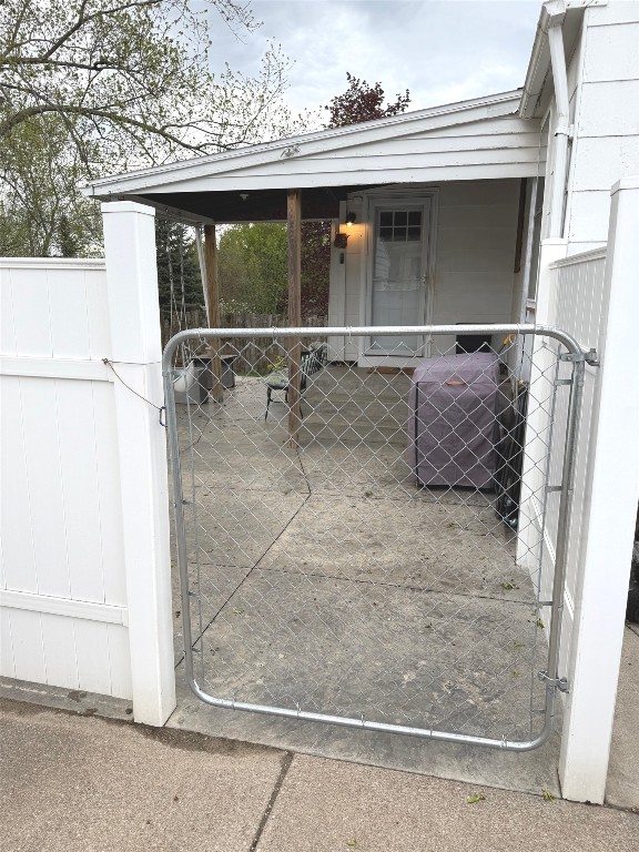view of gate featuring fence