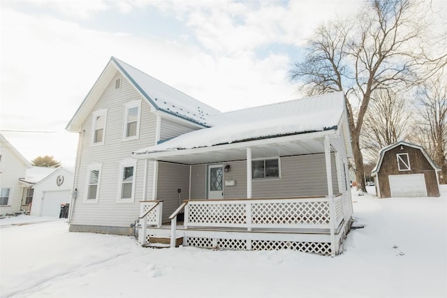 view of front of property featuring covered porch and a storage unit