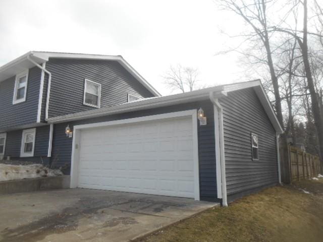 view of side of home with a garage