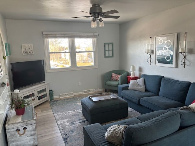 living room featuring ceiling fan and light wood-type flooring