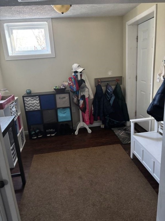 bedroom with dark hardwood / wood-style floors