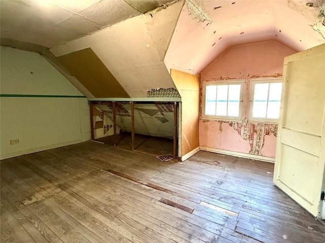 bonus room featuring vaulted ceiling and wood-type flooring