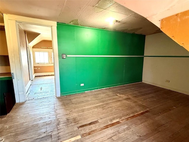 spare room with hardwood / wood-style flooring