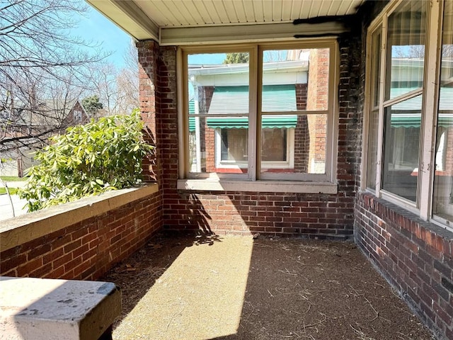 view of side of home featuring brick siding