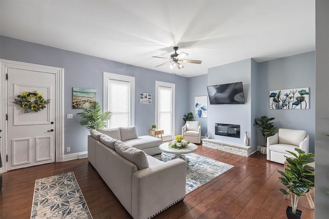 5700 Franklin Rd, Fairview, PA 16415 - living room with dark wood-style floors, a ceiling fan, and a glass covered fireplace