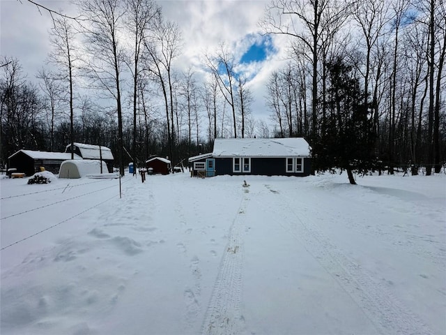 view of yard layered in snow