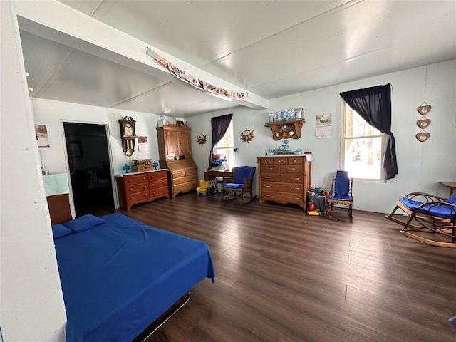 bedroom with dark hardwood / wood-style flooring