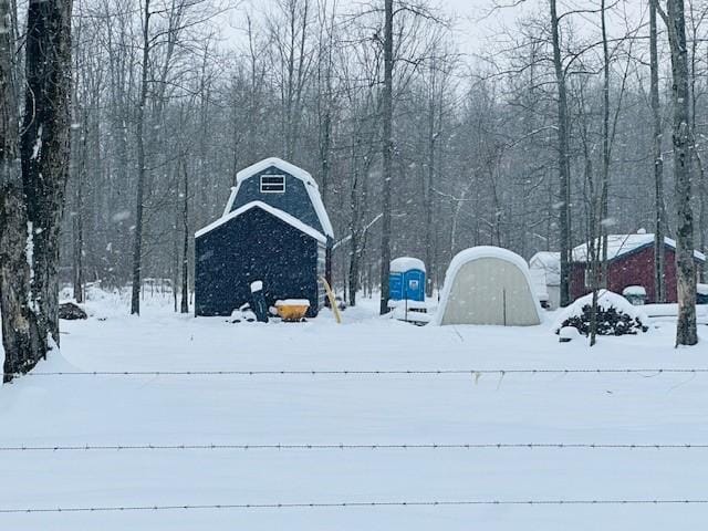 view of yard layered in snow