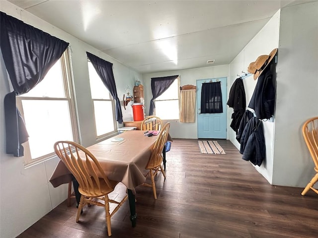 dining area with dark hardwood / wood-style floors