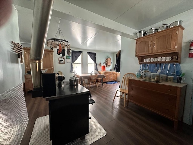 dining space with a chandelier and dark hardwood / wood-style floors