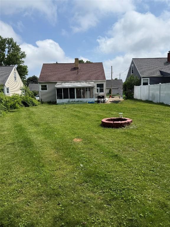 3508 Emerson Ave, Erie, PA 16508 - back of property with a sunroom and an outdoor fire pit