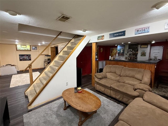 3508 Emerson Ave, Erie, PA 16508 - living room featuring bar, stairs, and wood finished floors