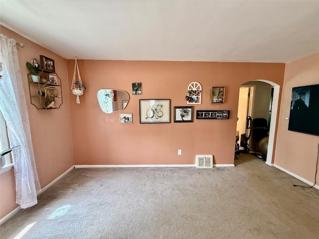 3508 Emerson Ave, Erie, PA 16508 - carpeted empty room featuring arched walkways and baseboards