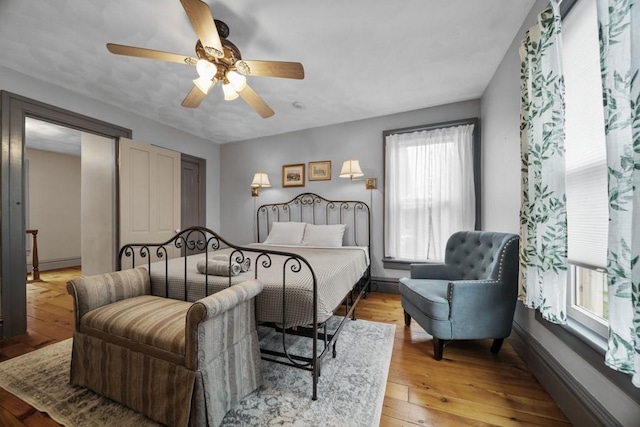 51-55 E Main St, North East, PA 16428 - bedroom with light wood-type flooring, ceiling fan, and baseboards