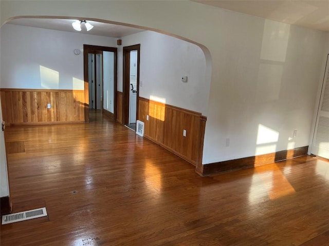 unfurnished room featuring dark hardwood / wood-style floors