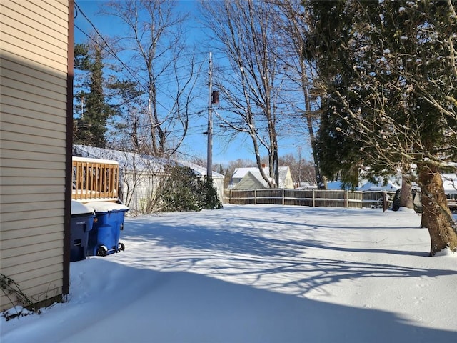 view of yard layered in snow