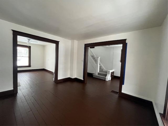 spare room with dark hardwood / wood-style flooring