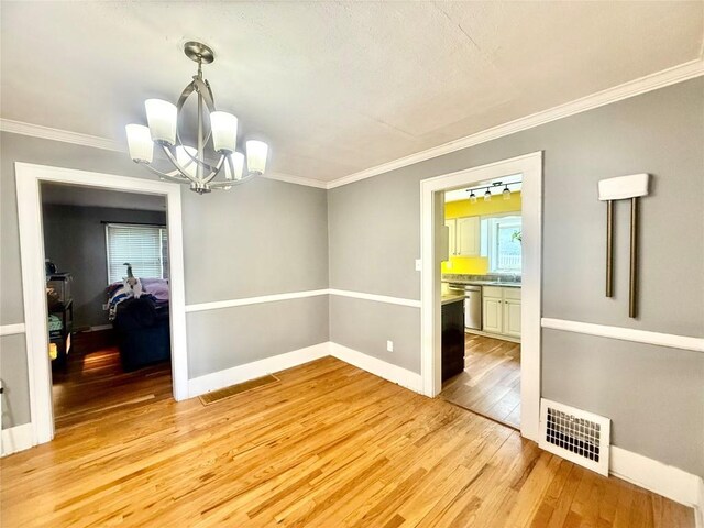 115 W 32nd St, Erie, PA 16508 - spare room featuring ornamental molding, arched walkways, hardwood / wood-style flooring, and stairs