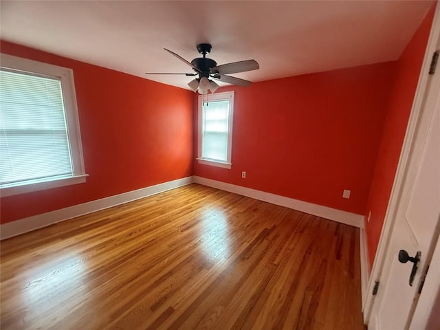115 W 32nd St, Erie, PA 16508 - empty room with wood finished floors and a ceiling fan