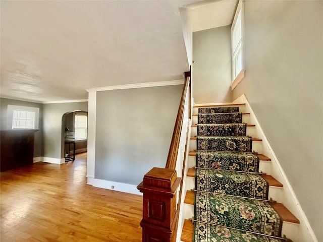 115 W 32nd St, Erie, PA 16508 - stairs featuring arched walkways, wood finished floors, and ornamental molding