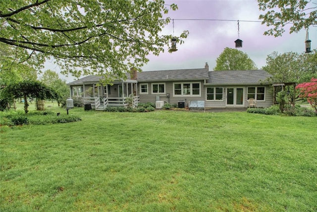 23186 Hatchtown Rd, Spartansburg, PA 16434 - back of house with a yard and cooling unit