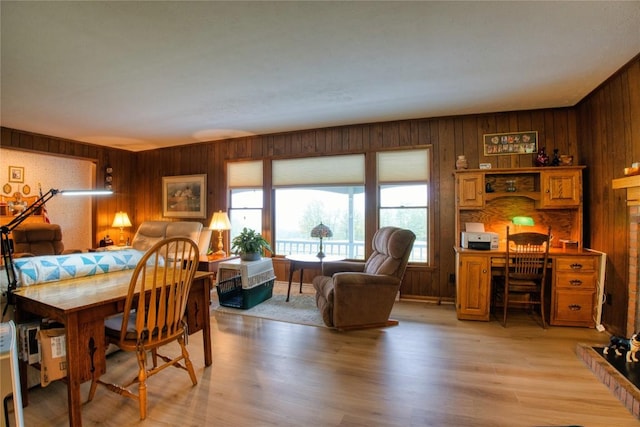 23186 Hatchtown Rd, Spartansburg, PA 16434 - dining area with wooden walls, a desk, and light wood-type flooring