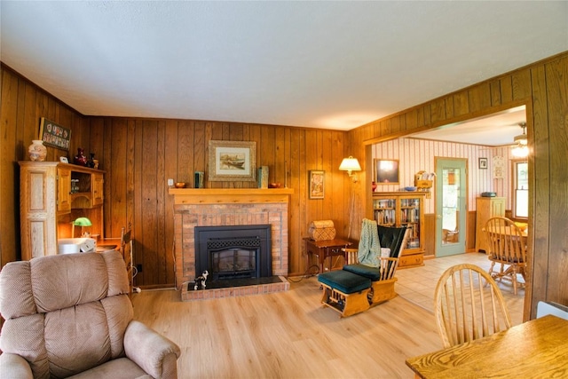 23186 Hatchtown Rd, Spartansburg, PA 16434 - living area with a brick fireplace, wood finished floors, and wooden walls